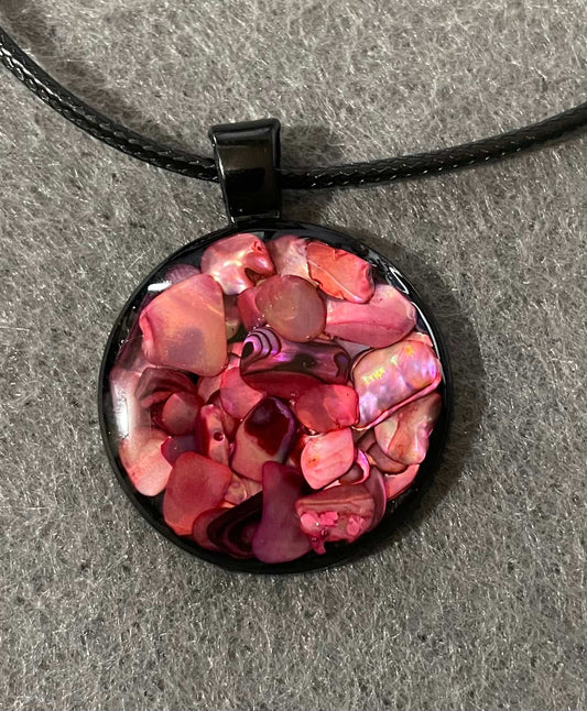 Red and pink resin pendant with rocks