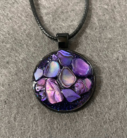 Purple resin pendant with stones