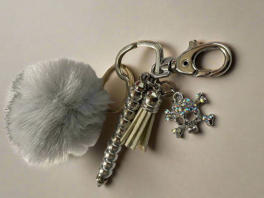 Skull and Bones keychian with charm and pom pom