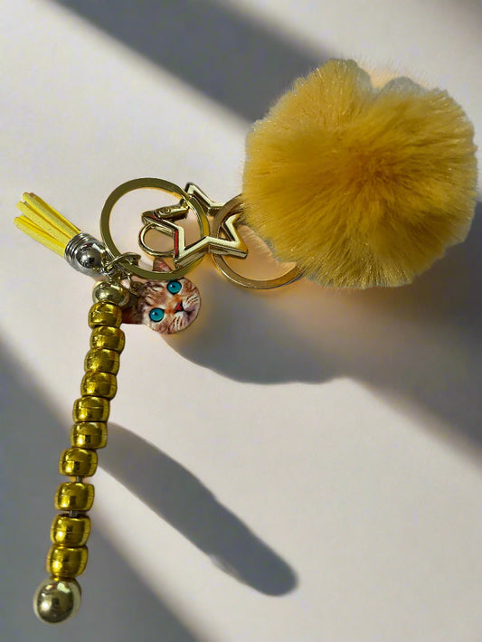 Gold Cat Keychian with beads and pom pom overview